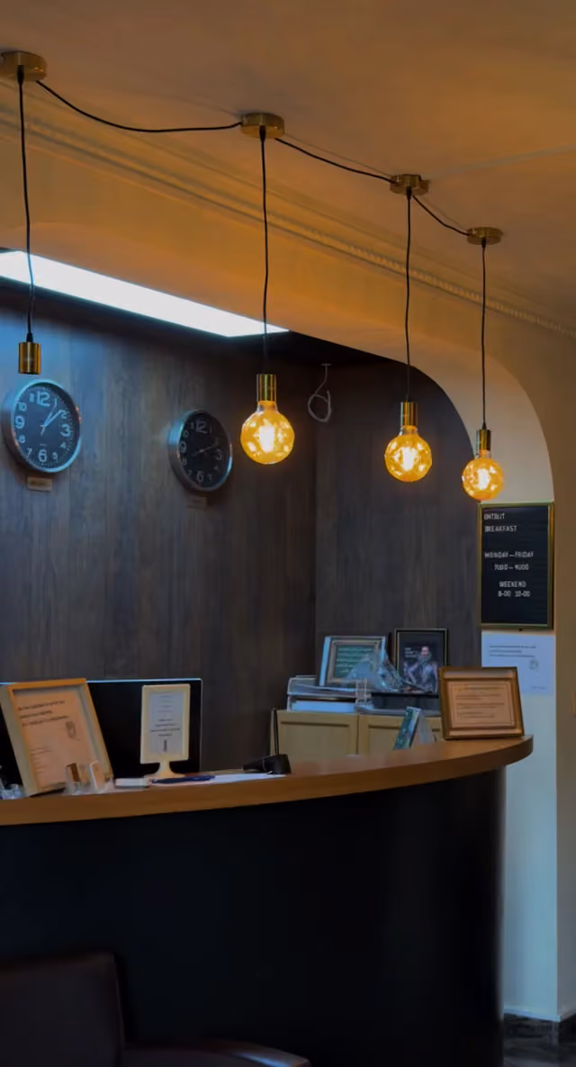 The reception with wall clocks and warm lighting